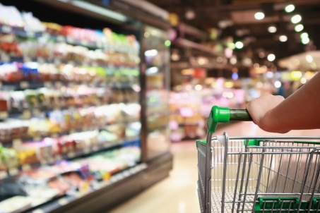 Shopping cart in a grocery store aisle